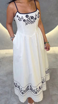 White dress with navy embroidery